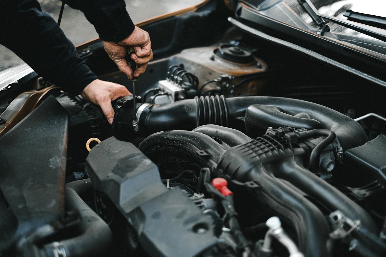 Services An Auto Mechanic Checking The Engine Of A Car 4315570